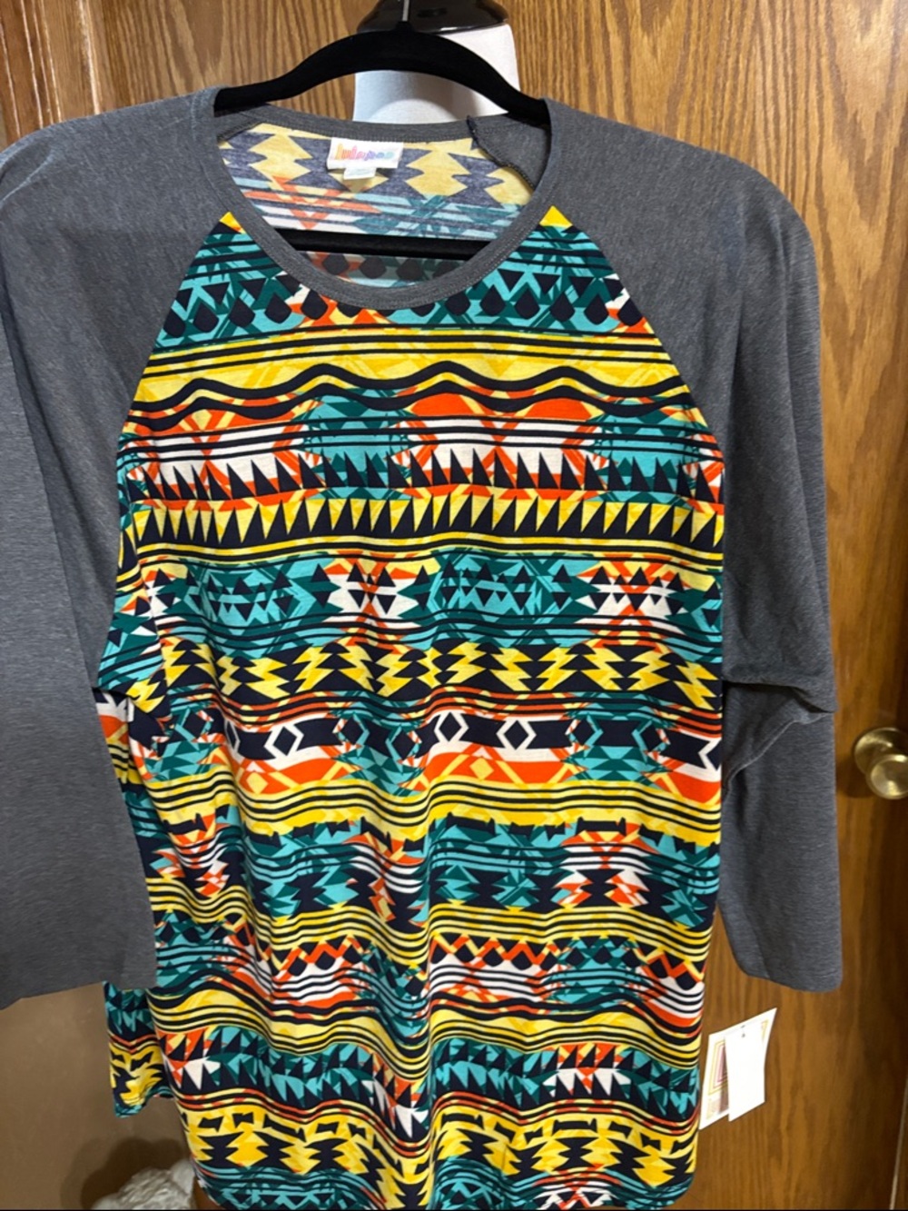 LuLaRoe women's multicolor Aztec print baseball tee with gray sleeves